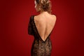 Slim woman in backless evening dress