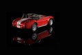 Back view of Shelby Cobra 427 Toy model car on a black background Royalty Free Stock Photo