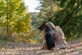 Back view of sitting woman and dog