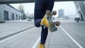 Unknown girl riding roller skates outdoor. Woman legs dancing on rollerblades. Royalty Free Stock Photo