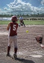 Back view of softball player after swinging bat Royalty Free Stock Photo