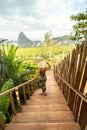 Back view of solo traveler woman enjoying Phang Nga bay view point, walking and relaxing. Tourist at Samet Nang She, Thailand Royalty Free Stock Photo