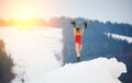 Woman snowboarder with snowboard on snowy slope at winter ski resort