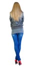 Back view of standing beautiful blonde woman. Royalty Free Stock Photo