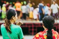 Back view of standing people watch Thai dance on the stage