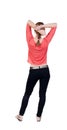 Back view of standing young beautiful blonde woman in jeans. Royalty Free Stock Photo