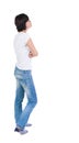 Back view of standing young beautiful brunette woman. Royalty Free Stock Photo