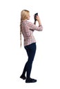 Back view of standing young beautiful girl with tablet computer in the hands of. Royalty Free Stock Photo