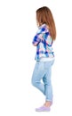 Back view of standing young beautiful redhead woman. Royalty Free Stock Photo