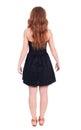 Back view of standing young beautiful redhead woman Royalty Free Stock Photo