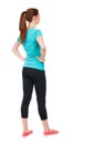 Back view of standing young beautiful woman. girl watching. Royalty Free Stock Photo