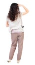 Back view of standing young beautiful woman. girl watching. Royalty Free Stock Photo