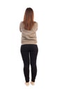 Back view of standing young beautiful woman in jeans. Royalty Free Stock Photo