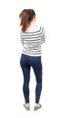 Back view of standing young beautiful woman in jeans. Royalty Free Stock Photo