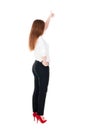 Back view of standing young redhead business woman showing thumb Royalty Free Stock Photo