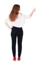 Back view of standing young redhead business woman showing thumb Royalty Free Stock Photo