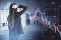 Back view of stressed out business woman looking at abstract downward forex chart on blurry office interior background. Crisis, Royalty Free Stock Photo