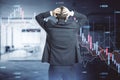 Back view of stressed out businessman looking at abstract downward forex chart on blurry office interior background. Crisis, Royalty Free Stock Photo