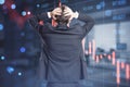 Back view of stressed young businessman standing in blurry office interior with abstract falling candlestick forex chart. Trade, Royalty Free Stock Photo