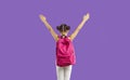 Back view of school student with pink backpack standing isolated on purple background