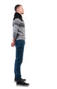 Back view of a stylish man in gray winter sweater