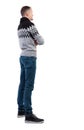 Back view of a stylish man in gray winter sweater