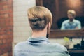 Back view of stylish trendy haircut of a bearded harsh man. He h Royalty Free Stock Photo