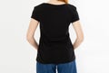 Back view t-shirt design, happy people concept - smiling red hair woman in blank black t-shirt pointing her fingers at herself, Royalty Free Stock Photo