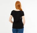 Back view t-shirt design, happy people concept - smiling red hair woman in blank black t-shirt pointing her fingers at herself, Royalty Free Stock Photo