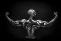 Back view of tattoed bodybuilder with outstretched arms Royalty Free Stock Photo