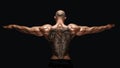 Back view of tattoed bodybuilder with outstretched arms Royalty Free Stock Photo