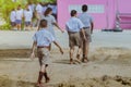 Back view of the teacher and the students walking go to study at the classroom