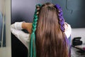 Teenage girl with colored braids