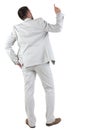 Back view of thinking young business man in white suit. Royalty Free Stock Photo