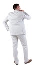 Back view of thinking young business man in white suit. Royalty Free Stock Photo