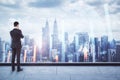 Back view of thoughtful businessman looking at city view with forex chart. Trade and market concept. Double exposure Royalty Free Stock Photo