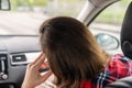 Back view of tired Woman passenger traveling by car on the highway . Freedom concept. Royalty Free Stock Photo