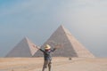 back view of tourist woman standing in front of pyramids. Egypt, Cairo - Giza Royalty Free Stock Photo
