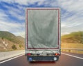 Back view of truck cargo transport container on the high way road Royalty Free Stock Photo