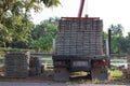 Back view of truck while load stack of prestressed concrete slabs for construction