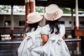 Back view of two cute asian little girls waiting for the train Royalty Free Stock Photo