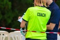 Back view of two female sport swimming coaches discussing about