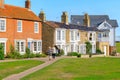 Back view of two female tourists walking in the popular seaside town Southwold of the UK