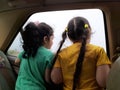 Back view of two little child girl in car viewing outside Royalty Free Stock Photo