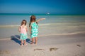 Back view of two little cute fashion sisters on Royalty Free Stock Photo