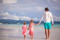 Back view of two little girls and young father on Royalty Free Stock Photo