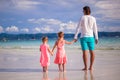 Back view of two little girls and young father on Royalty Free Stock Photo