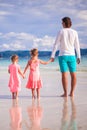 Back view of two little girls and young father on Royalty Free Stock Photo