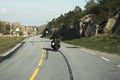 Back view of two motorcyclists on mountain road