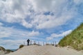 Backview of a person on a sand dune in Nymindegab Strand, Denmark Royalty Free Stock Photo